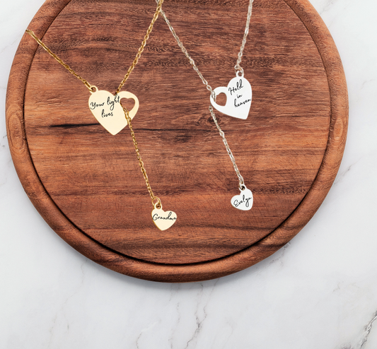 Gold memorial heart necklace with trailing smaller heart pendant