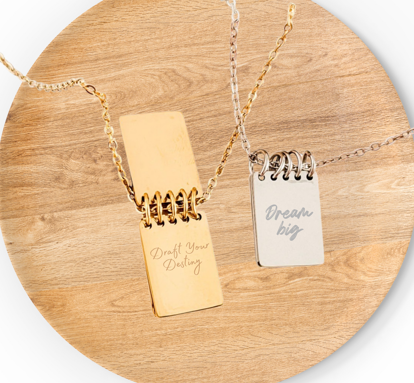 Silver steno notebook necklace showing engraved inspirational quote