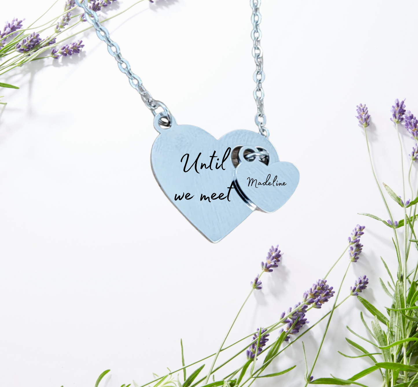 Close-up of engraved memorial heart pendant with custom message